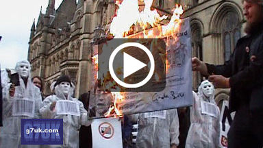 NO2ID campaigners burn a giant ID card in front of Manchester town hall