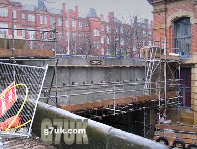 The 130-year-old cast-iron bridge on Canal Street has been replaced by a concrete one