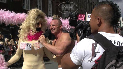 Chris Geary attempts to interview Wynnie LaFreak at the Manchester Pride parade in 2011