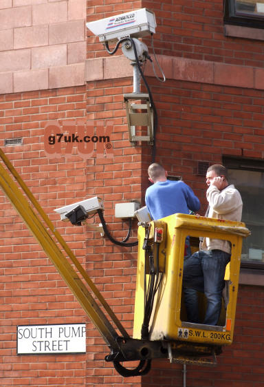 Workmen with a CCTV camera in Manchester