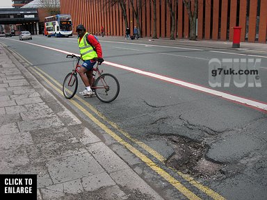 A number of severe potholes have appeared on Oxford Road, Manchester. Photo date: 28 Feb 2010